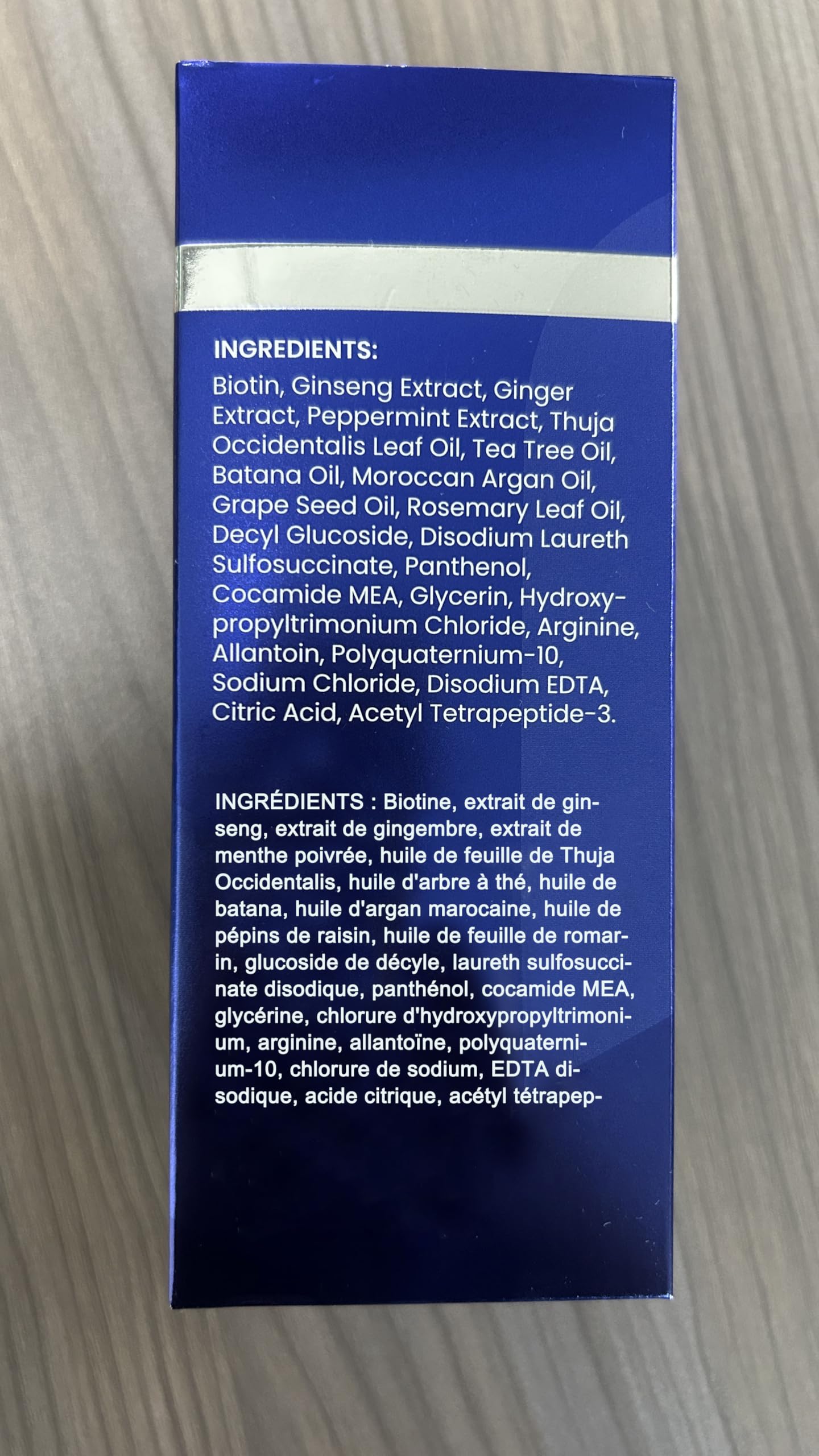 Uttse Biotion Shampoo dark blue bottle on counter premium hair care