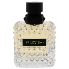 Valentino Donna Born in Roma Yellow Dream EDP cap closeup shows premium packaging for gifting.