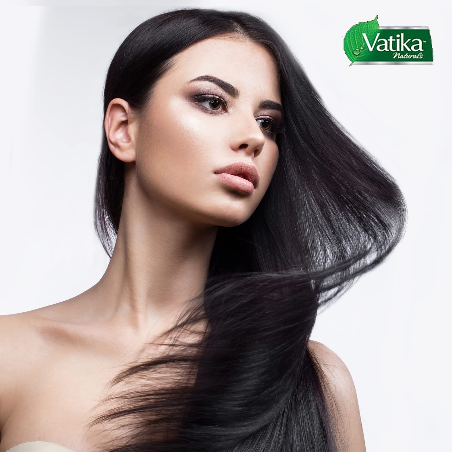 Vatika Naturals Dabur hair oil ingredients almond coconut sesame close-up.