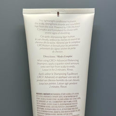 GRO+ conditioner at the scalp during gentle massage for hydration.