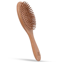 Vera Essence bamboo brush detangling action shows gentle glide for all hair types.