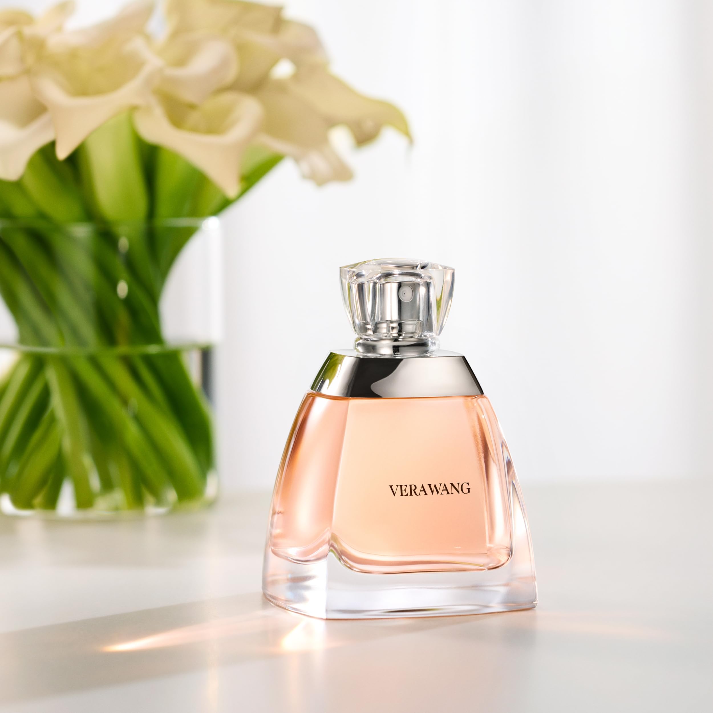 Vera Wang lilies note closeup emphasizes bright feminine bouquet and charm.