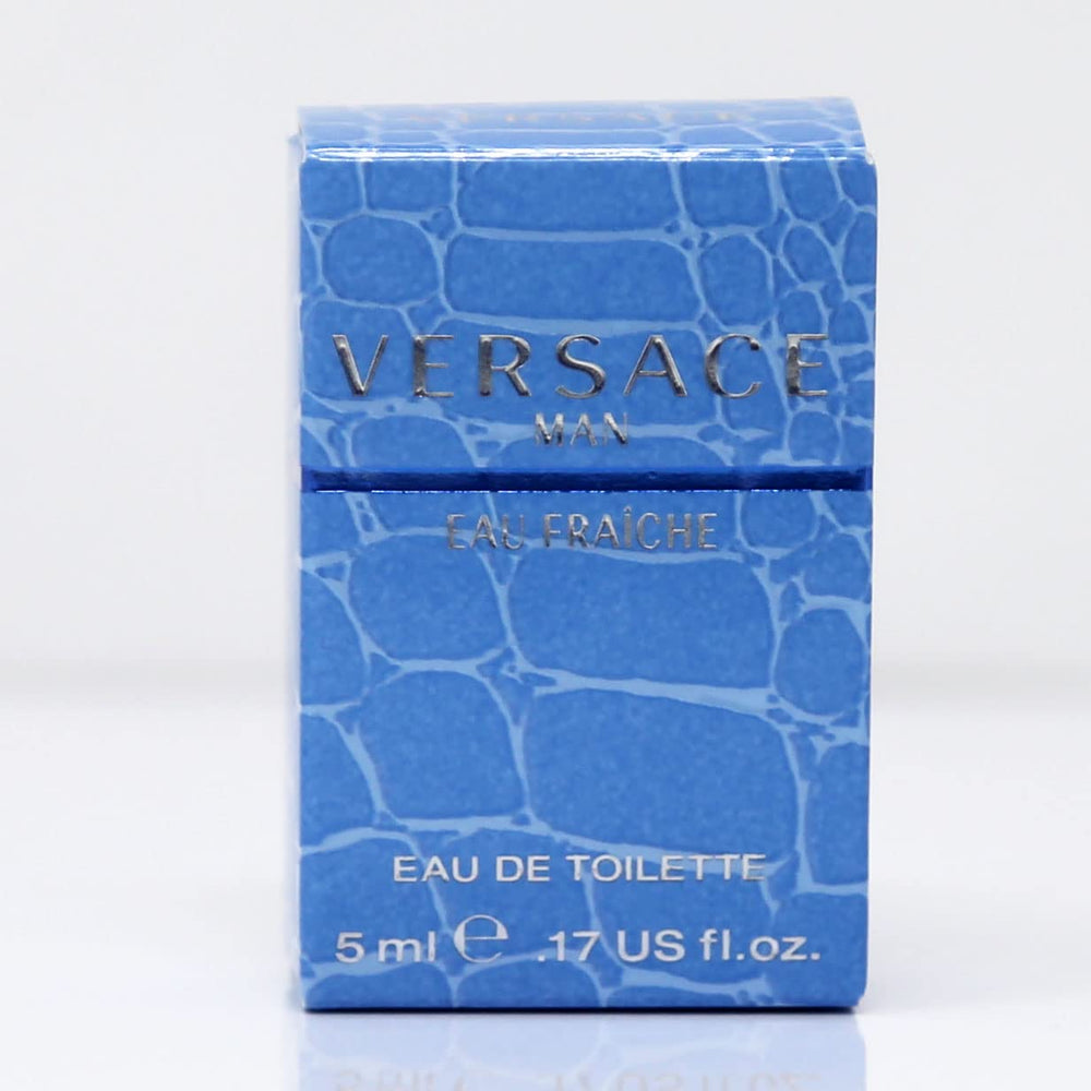 Versace Man Eau Fraiche mini label close-up, emphasizing amber-woody base and refreshing top notes.
