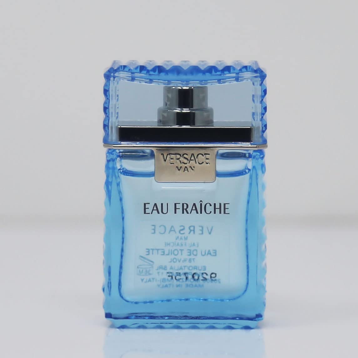 Versace Man Eau Fraiche mini packaging, compact travel-size design for on-the-go fragrance.