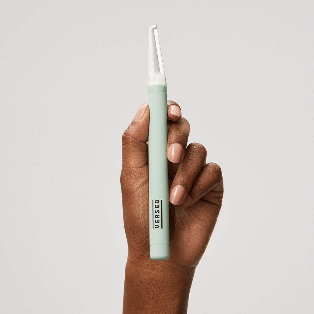 Versed dermaplaning tool positioned at a 45-degree angle for safe, precise grooming.