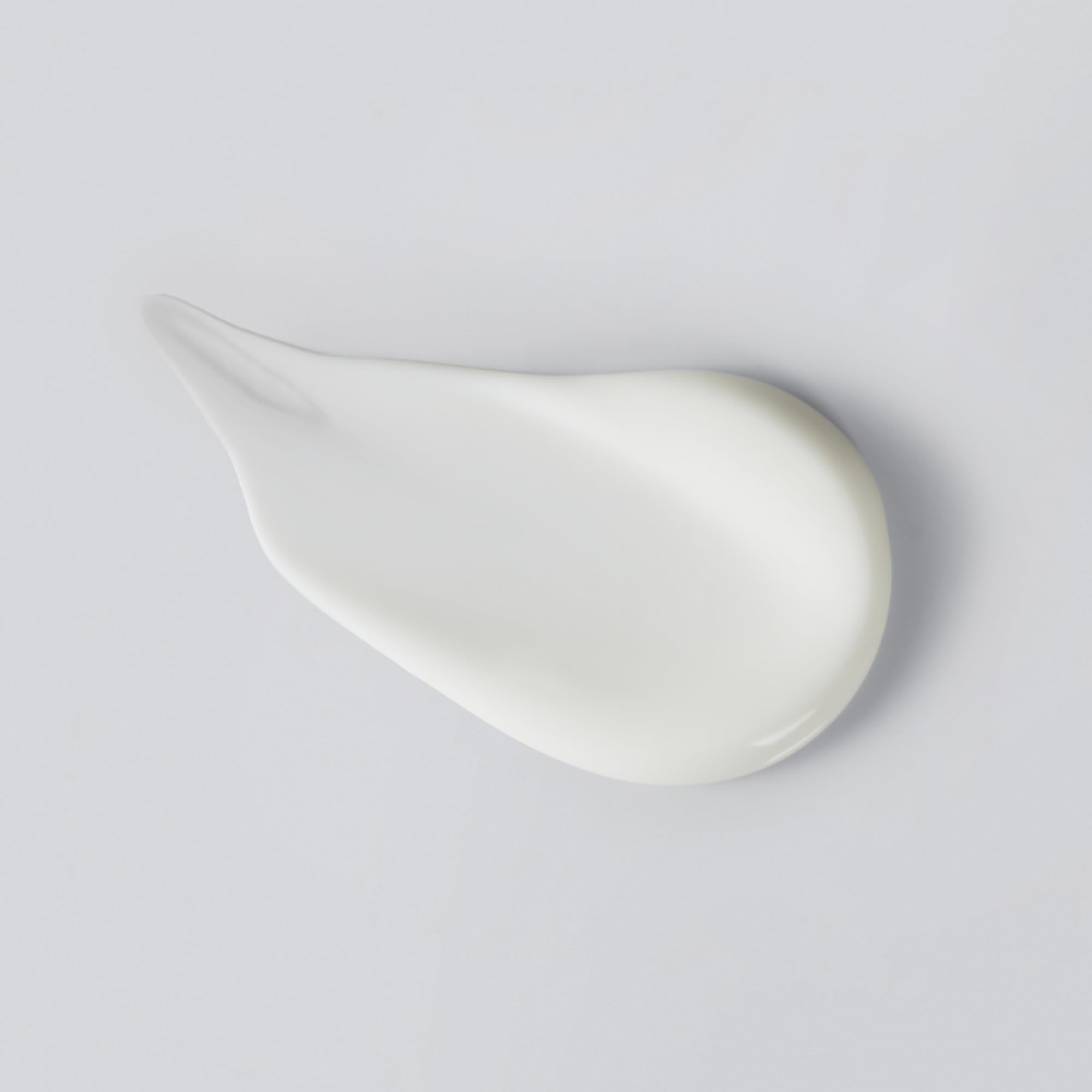 Versed Press Restart Retinol Body Lotion texture close-up shows a silky, non-greasy finish.