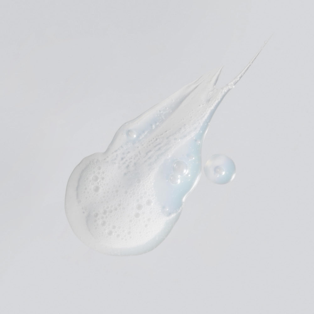 Versed Purist foaming lather closeup demonstrates gentle daily cleanser.