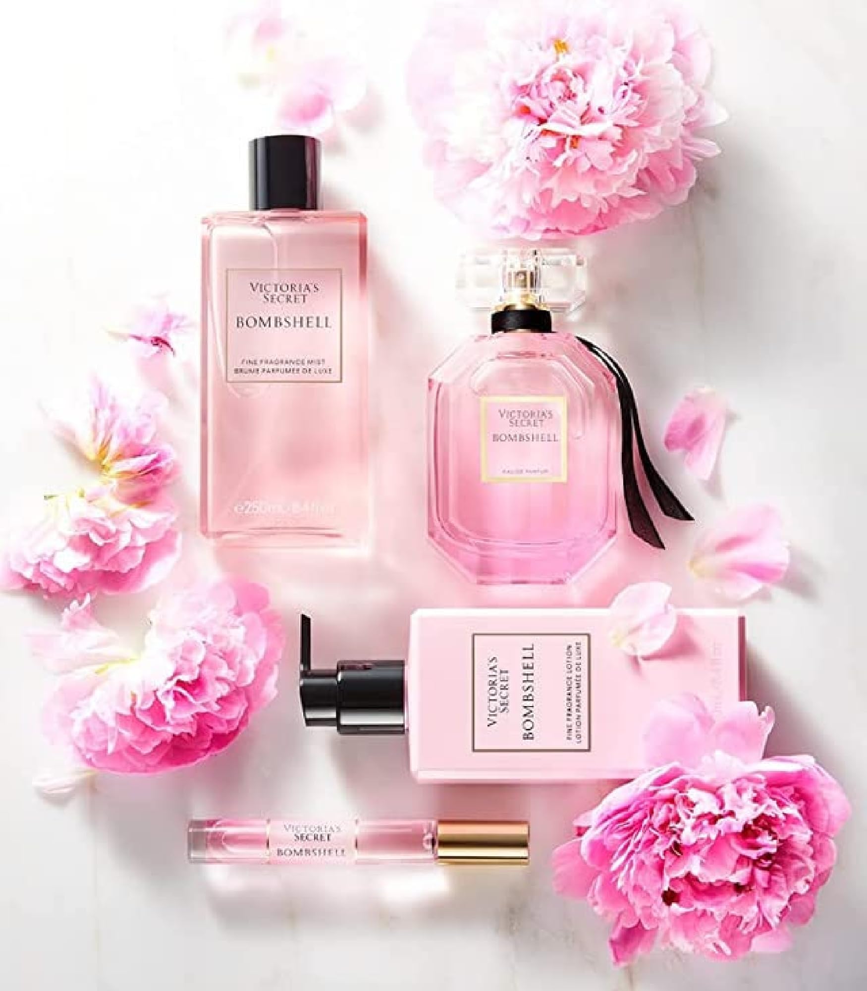 Victoria's Secret Bombshell mist application demonstrates easy layering and travel use