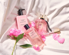 Victoria's Secret Bombshell Mist spray action image for effortless scent touch-ups.