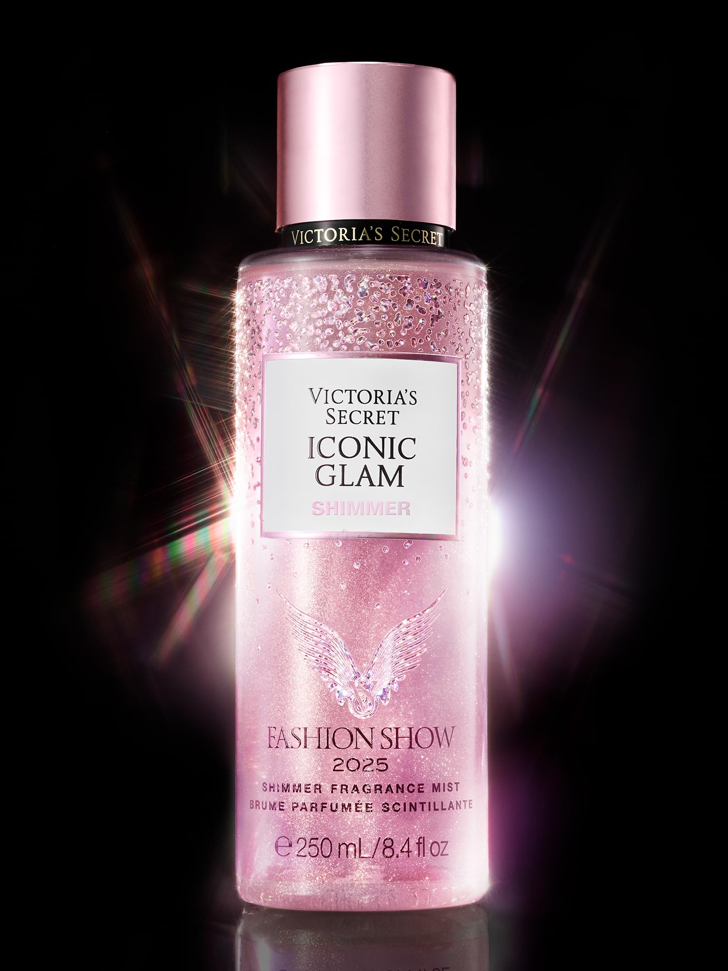 Victoria's Secret Fashion Show Iconic Glam Shimmer bottle closed showcases travel-friendly size for on-the-go touch-ups.