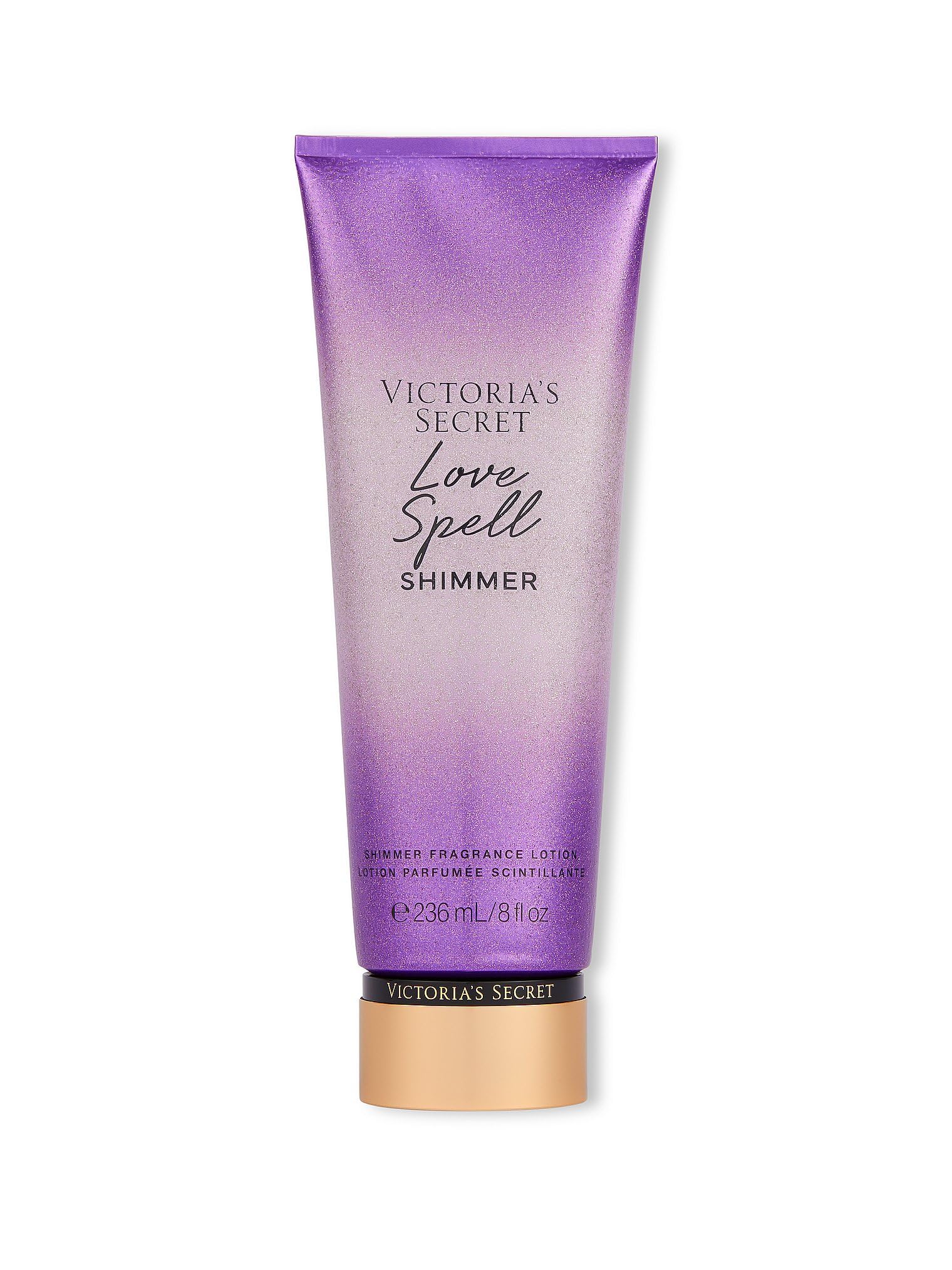 Victoria's Secret Love Spell Shimmer Fragrance Lotion bottle gleaming with a celebratory shimmer finish for glowing skin.