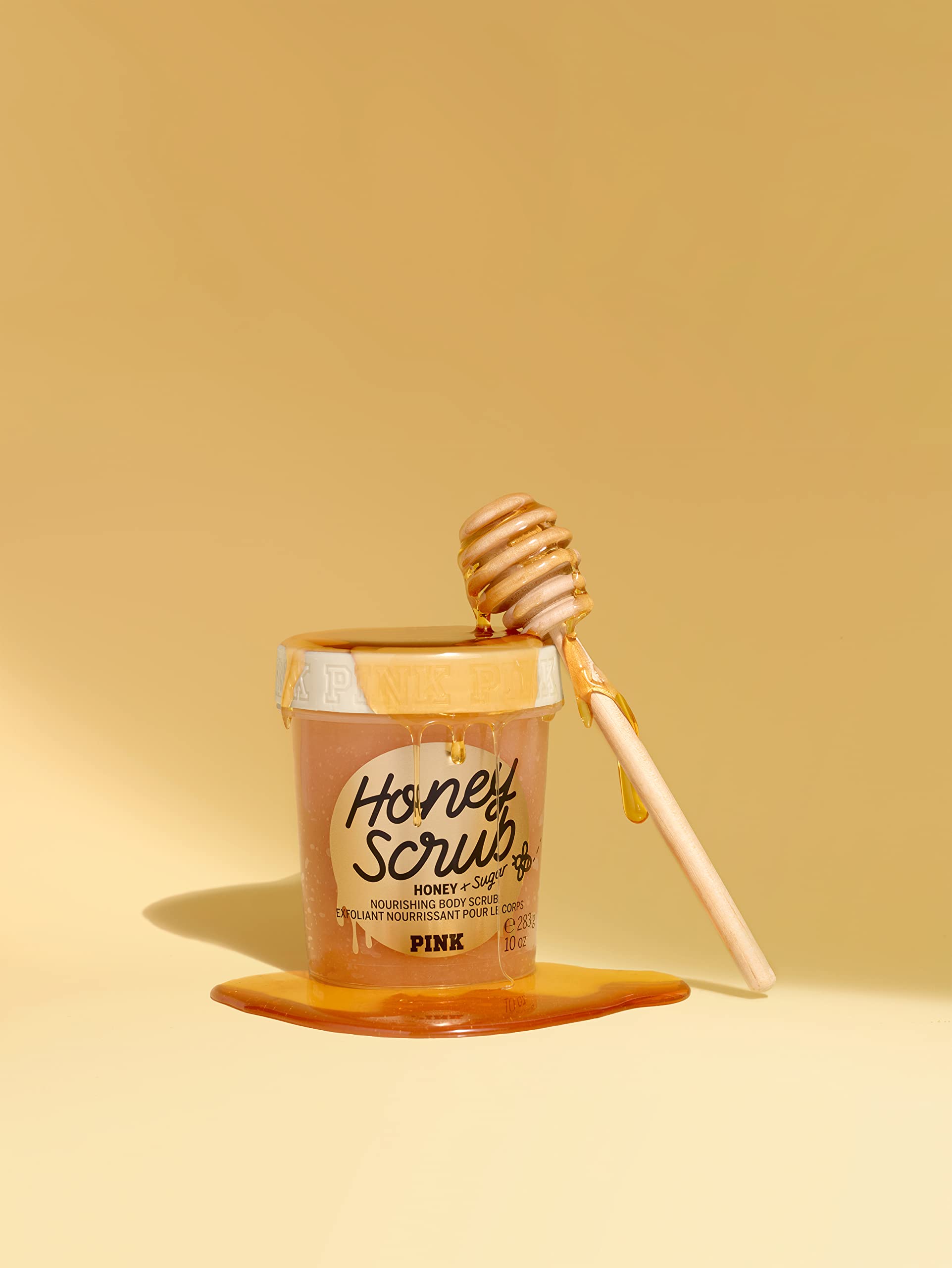 Victoria's Secret Pink Honey Nourishing Scrub honey-drops close-up highlighting honey for skin nourishment.