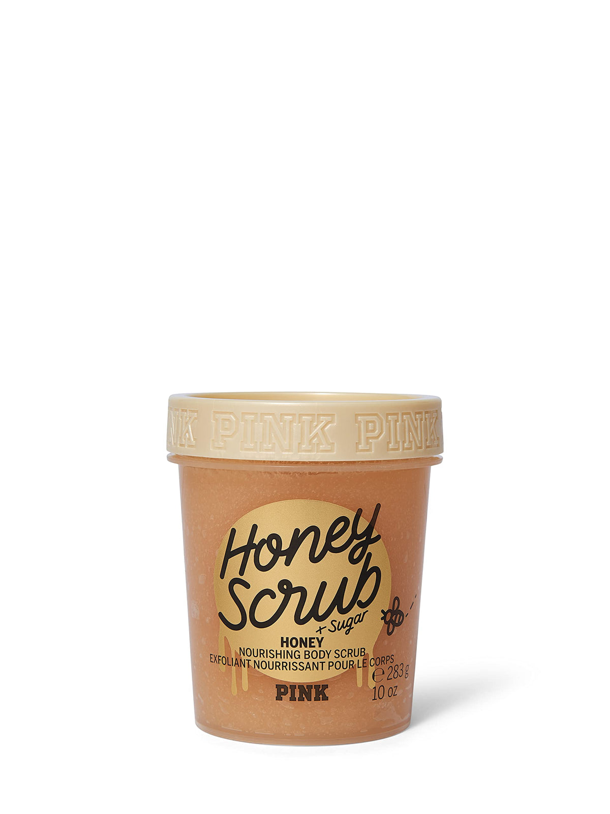 Victoria's Secret Pink Honey Nourishing Scrub jar on counter for smooth, radiant skin prep.