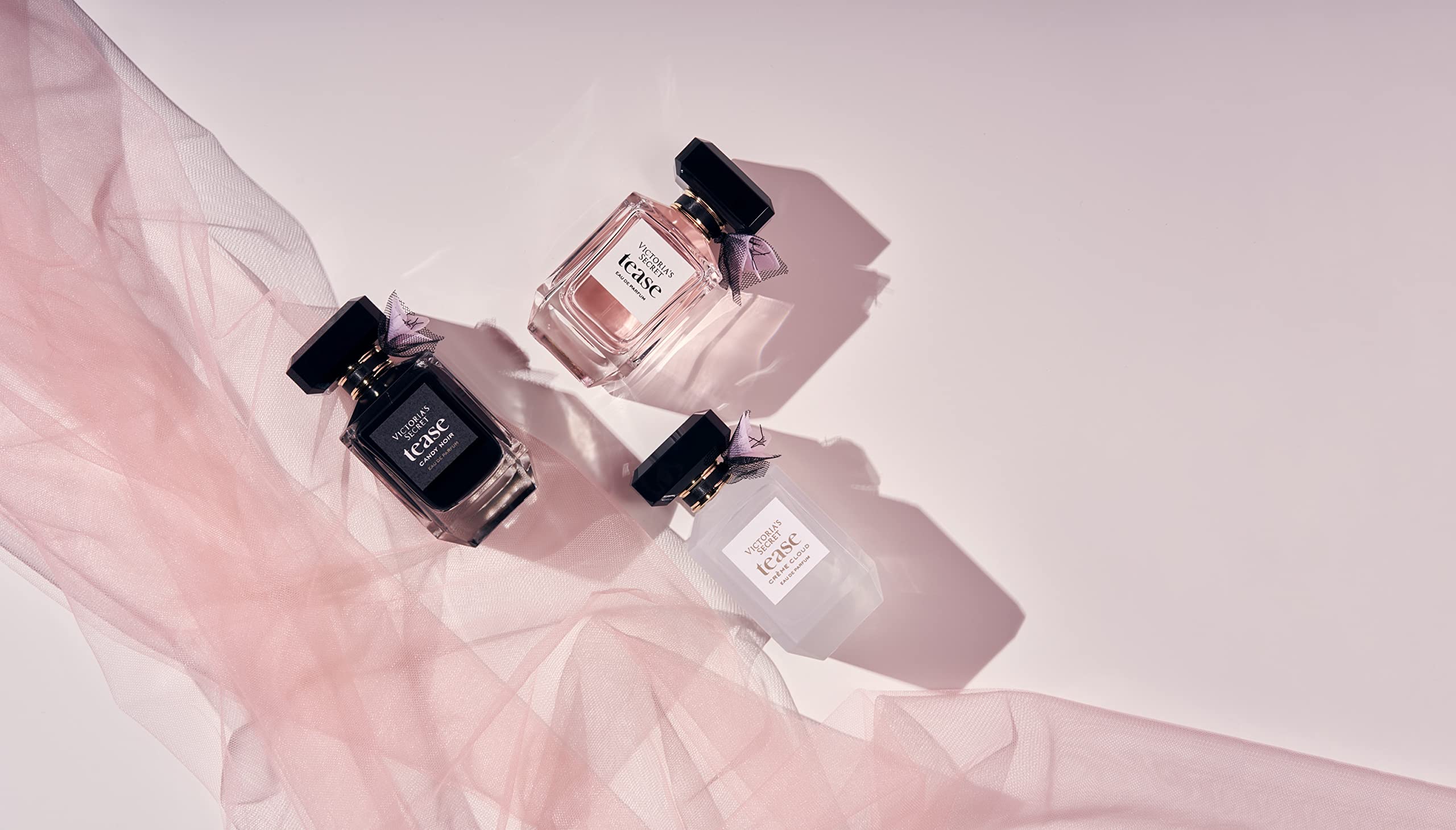 Tease Creme Cloud santal flower accent adds refined warmth.