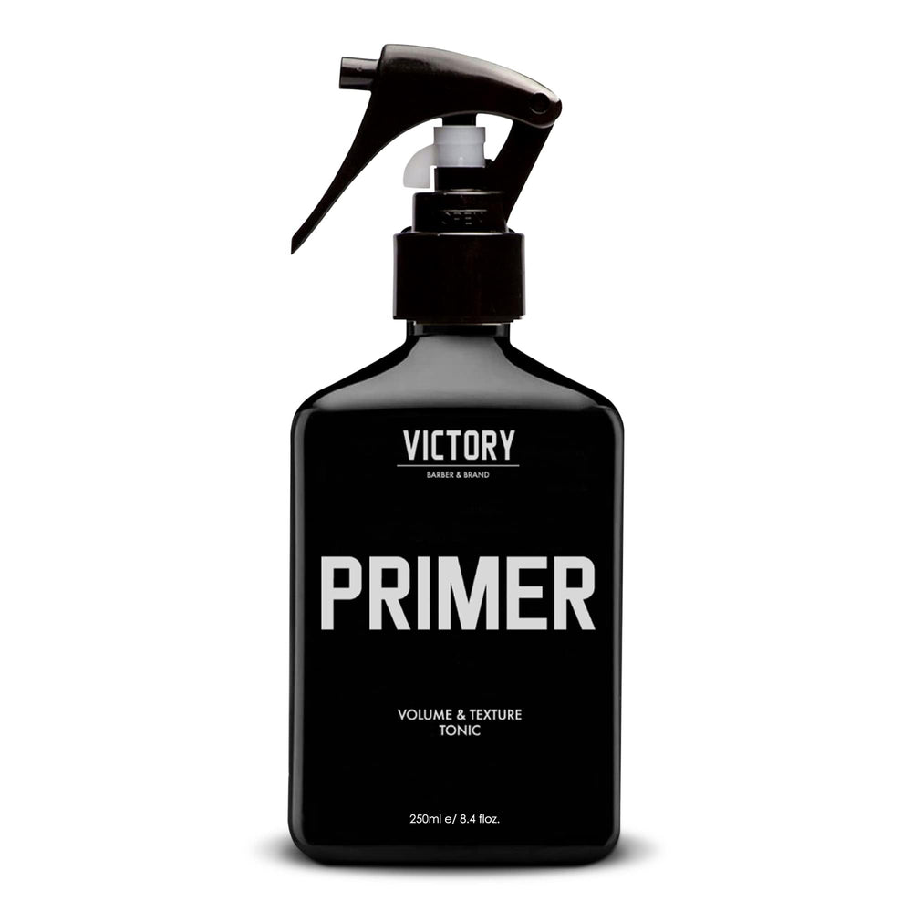 Victory Primer sea-salt-bottle demonstrates textured, fuller hair for casual beach-day style.