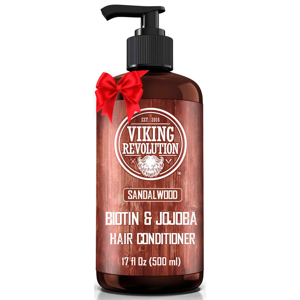 Viking Revolution sandalwood conditioner bottle label highlights biotin and jojoba benefits.