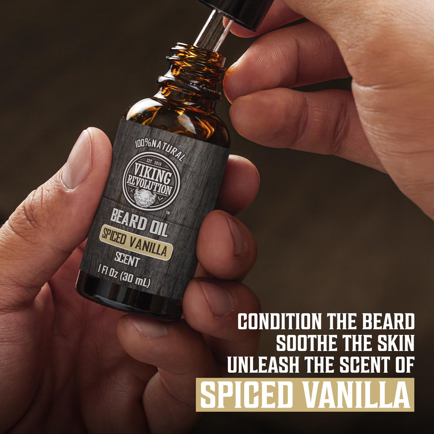 Beard oil dropper from Viking Revolution kit highlighting argan and jojoba nourishment.