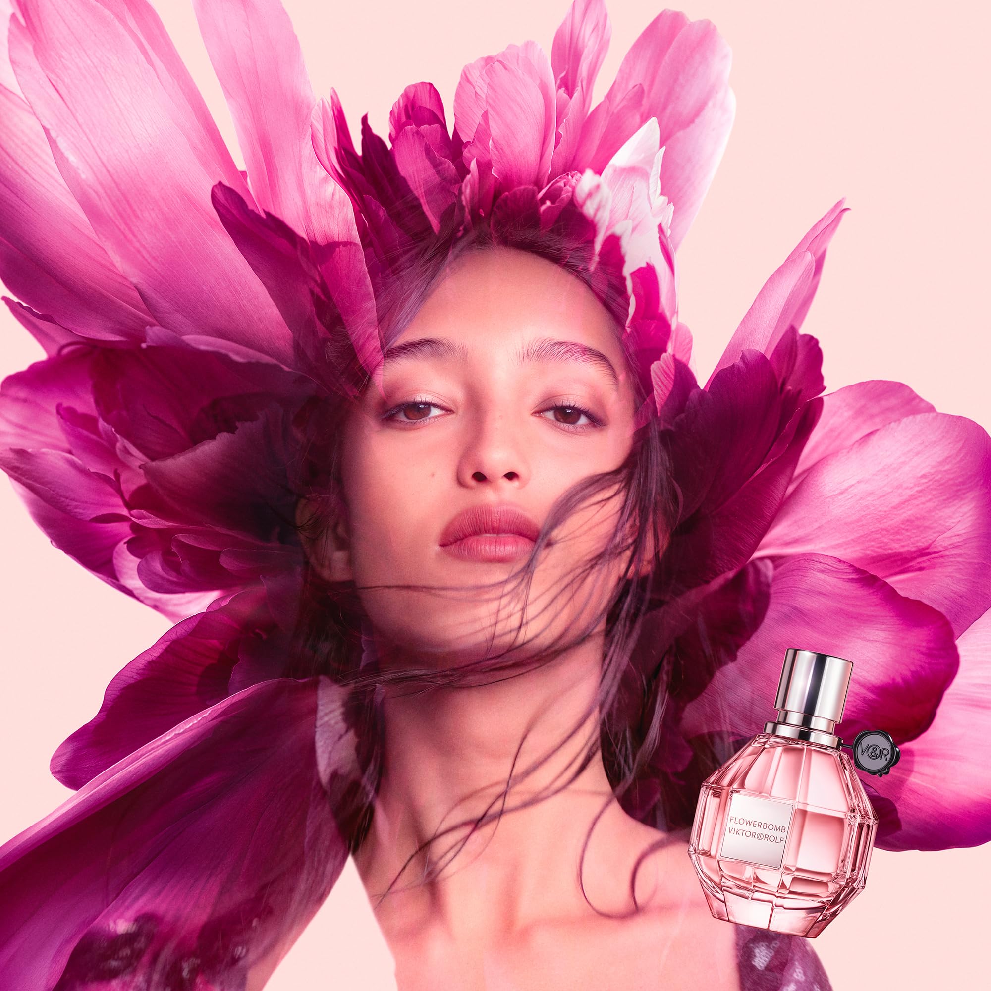 Viktor&Rolf Flowerbomb EDP applied to pulse points for lasting wear.
