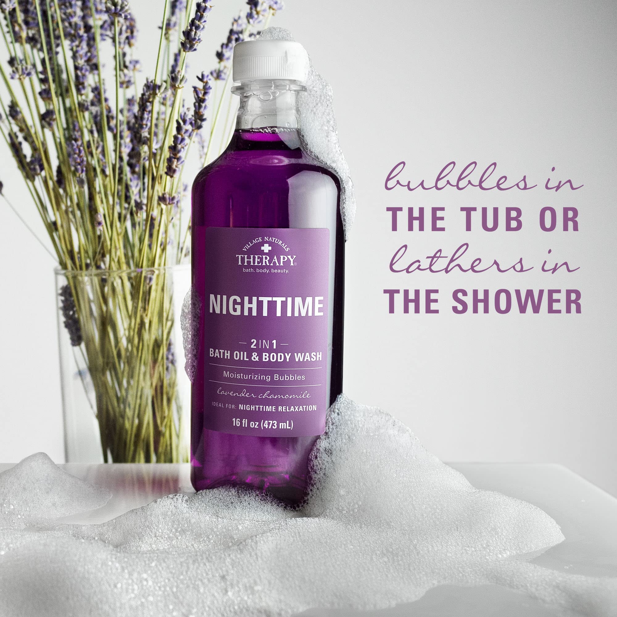 Village Naturals Therapy Nighttime Relief bath oil on a shower pouf for easy cleansing.