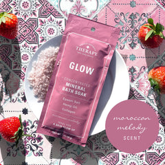 Glow bath soak being poured into a warm tub.