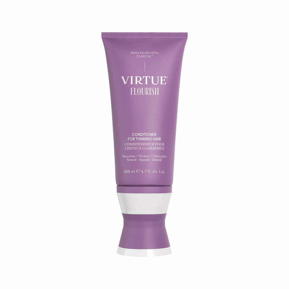 Virtue Flourish Conditioner bottle for thinning hair on a bathroom shelf.