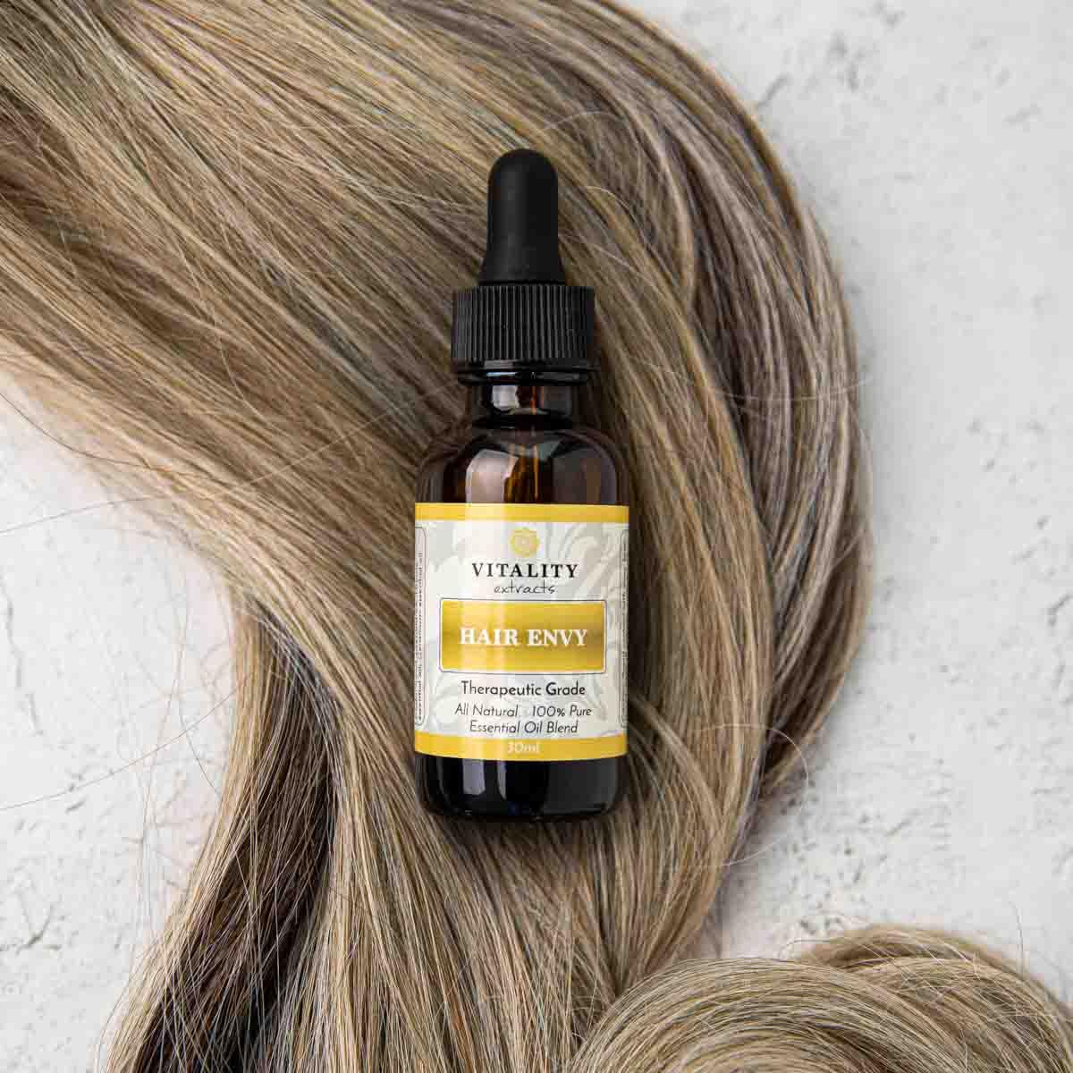 Vitality Hair Envy drops close-up emphasizing pure essential oils