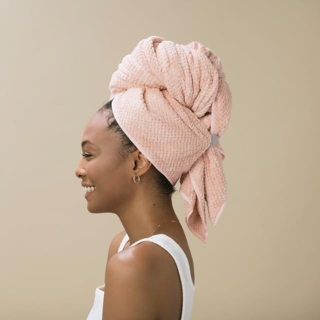 VOLO Hero Cloud Pink towel wrapped on head showcasing secure Snug Strap retention.