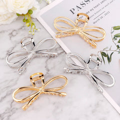 Vovii metal bow clip silver closeup emphasizes sleek shine and secure tension.