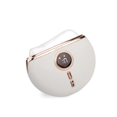 VRAIKO Aurora LED Gua Sha device close-up on white jade for soothing facial massage