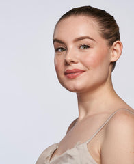 Wander Beauty On-the-Glow blush-on-cheeks application shows multitasking stick on face