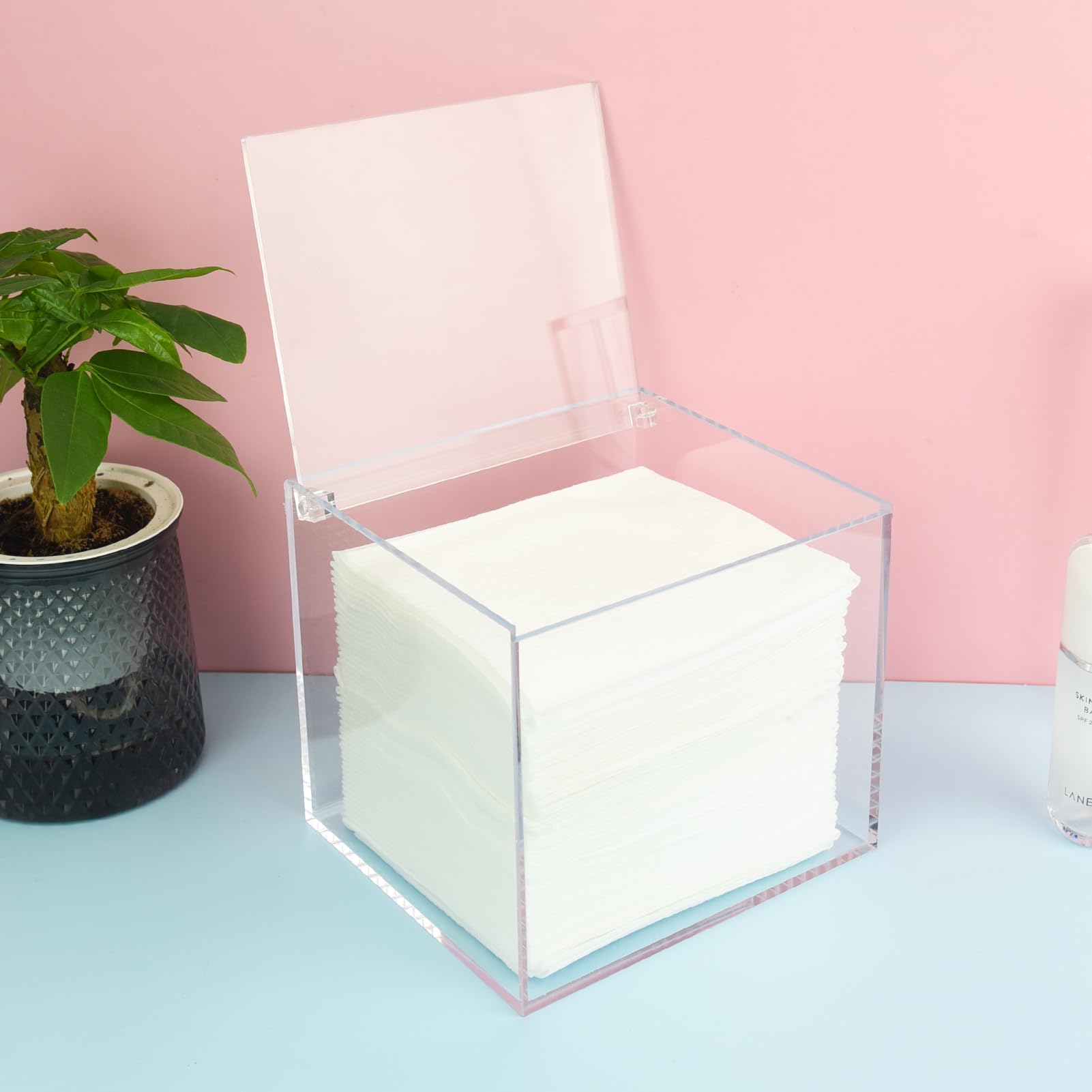Watpot home organization shows tidy vanity with disposable towels at hand.