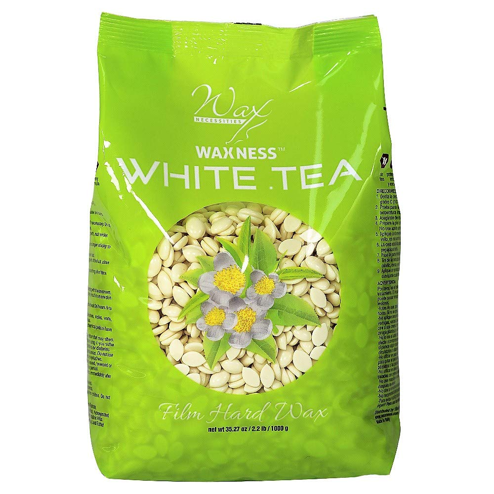 Wax Necessities packaging highlights film hard wax beads with White Tea Cream for sensitive skin.