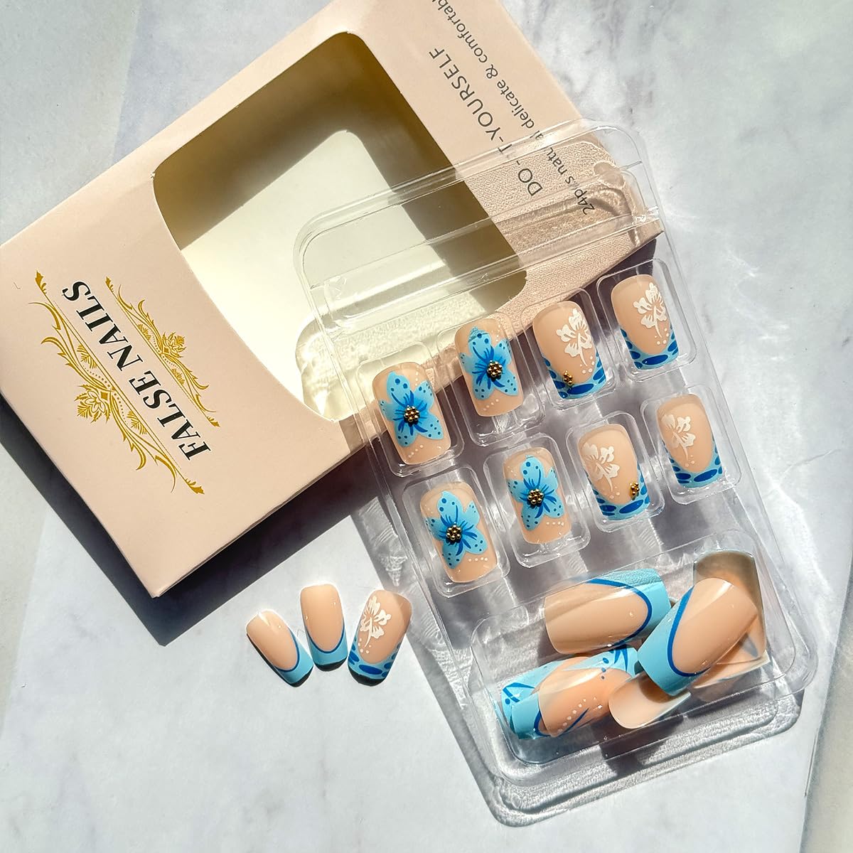 WBRRFJJ short square French-tip nails with gold rhinestones add subtle glamour for occasions.