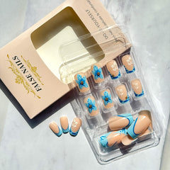 WBRRFJJ short square French-tip nails with gold rhinestones add subtle glamour for occasions.