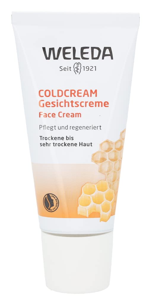 Weleda balm being smoothed onto cheeks for facial hydration.