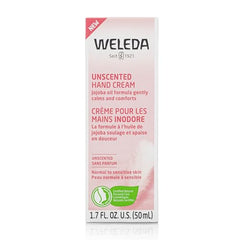 Weleda hand cream application close-up shows silky skin after use.