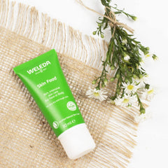 Weleda Skin Food Small 1oz Cream on hand demonstrates quick absorption and long-lasting softness.