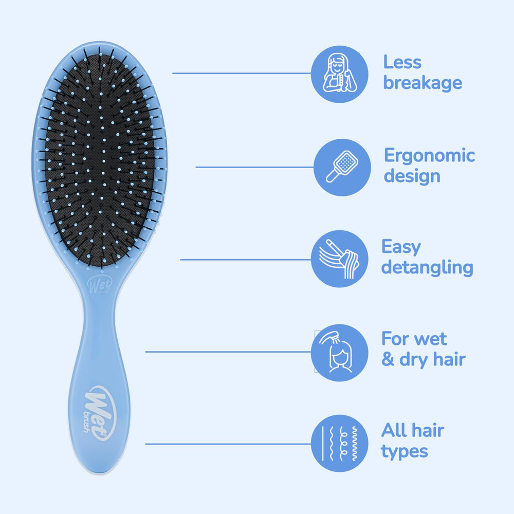 Wet Brush held in hand to show scale and comfortable control during brushing