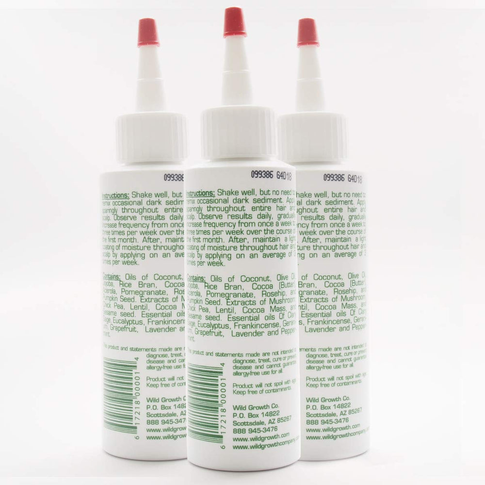 Wild Growth Hair Oil pour illustrating easy application for smoother styling