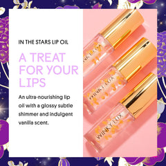 Winky Lux lip oil close-up reveals golden stars within the tube