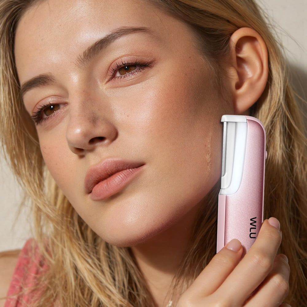 WLU Dermaplaning Tool compact pink design with long-lasting battery for travel use.