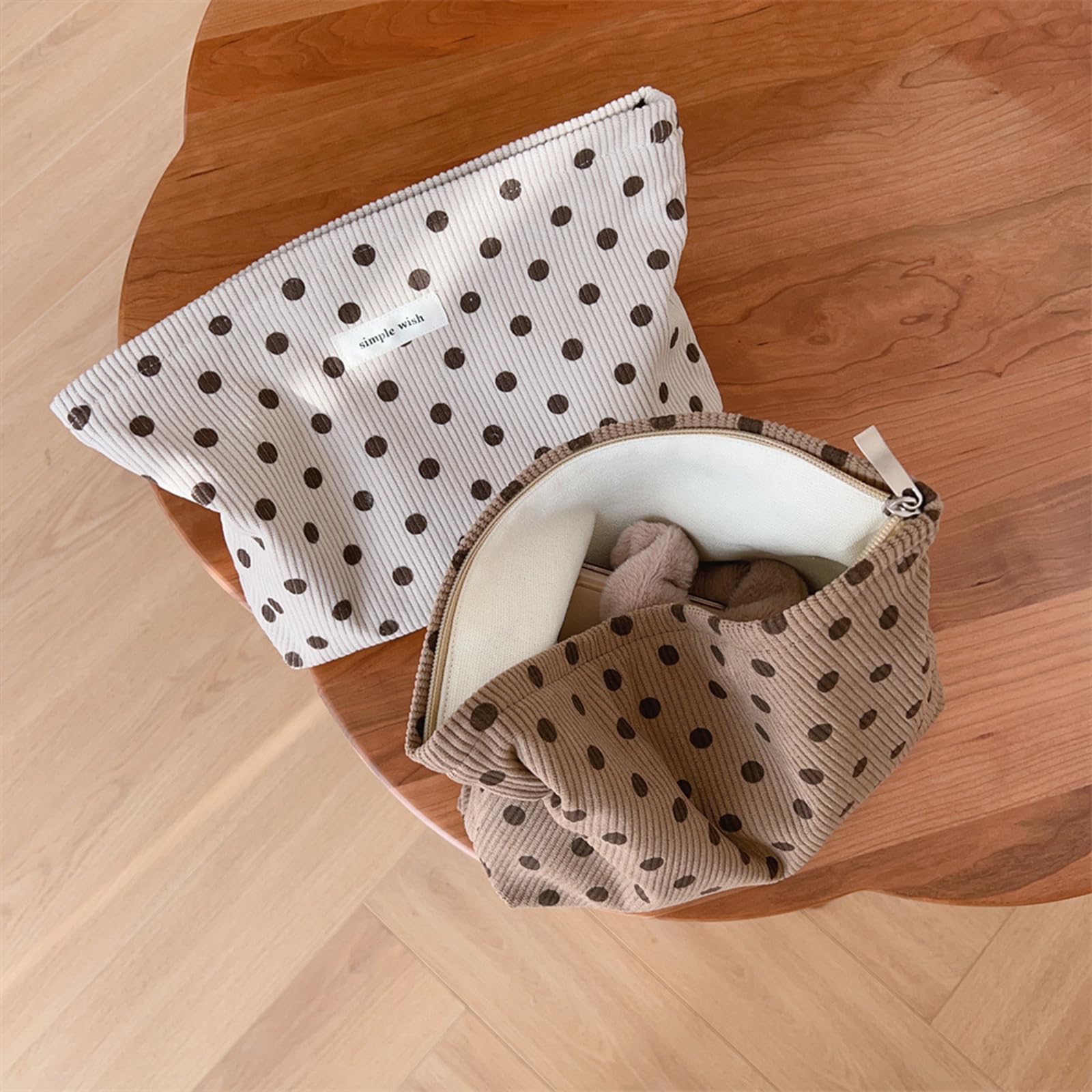 Wudygirl beige polka dot cosmetic bag showcasing stylish design and versatility.