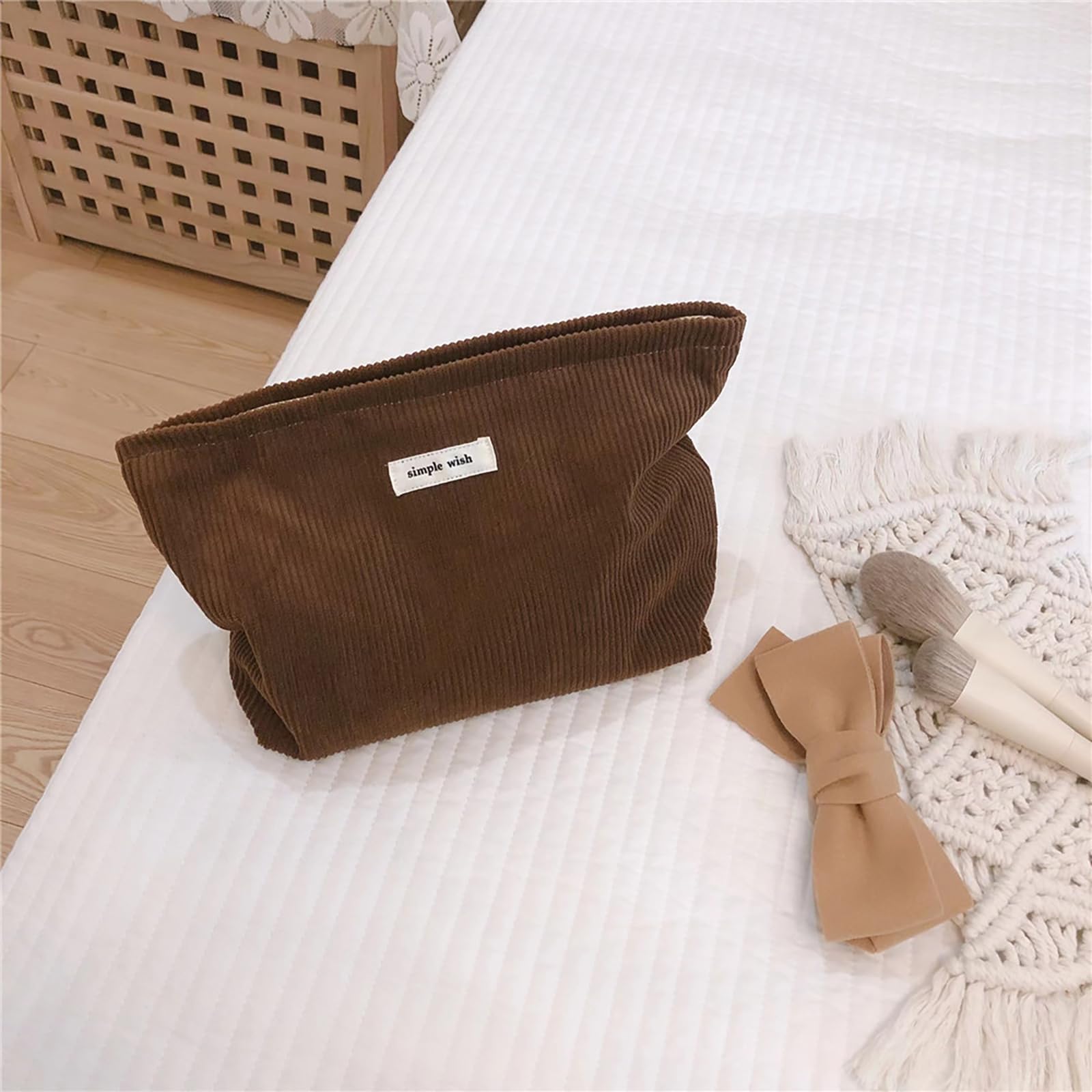 Wudygirl makeup bag in coffee open zipper reveals organized compartments for cosmetics.