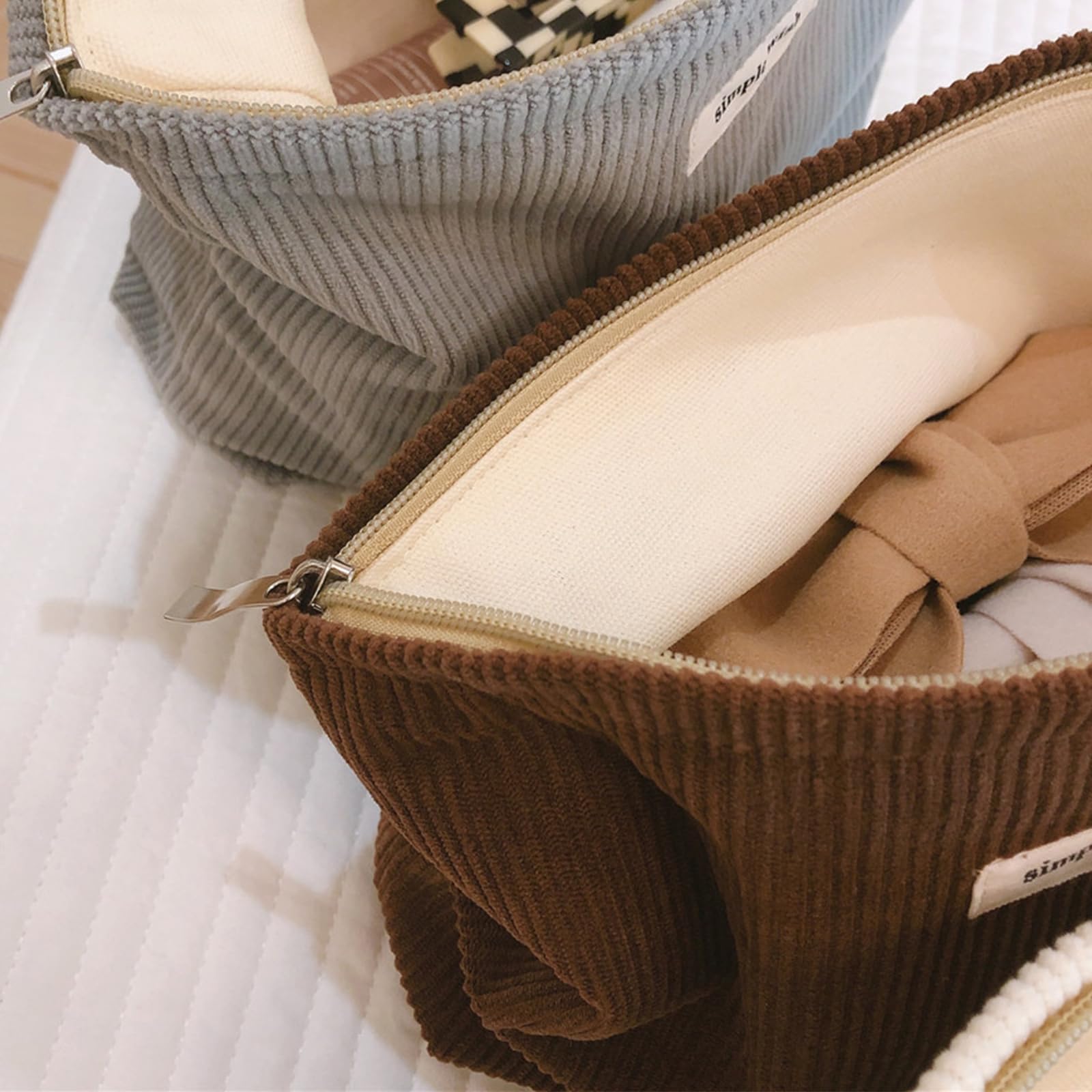 Wudygirl makeup bag showcases stylish design suitable for daily use and outfits.
