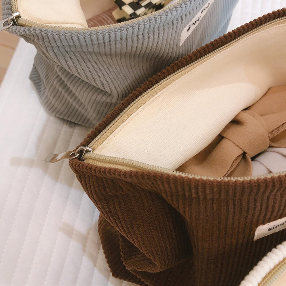 Wudygirl makeup bag showcases stylish design suitable for daily use and outfits.