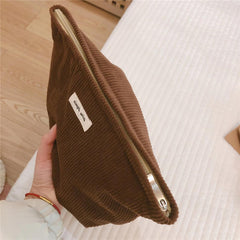 Wudygirl coffee makeup bag travel-ready size fits backpacks and suitcases.