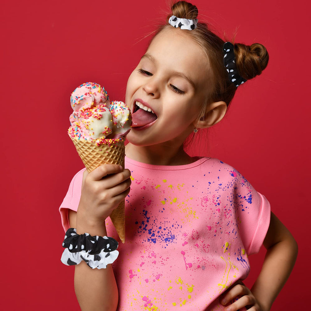 Xinnun cow-pattern hair accessory adds playful charm to outfits.