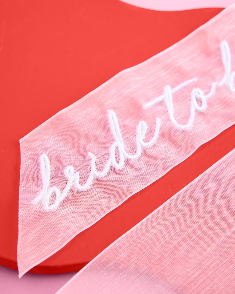 xo-fetti bachelorette party bow accessory ready to wear as a fun hair accent.