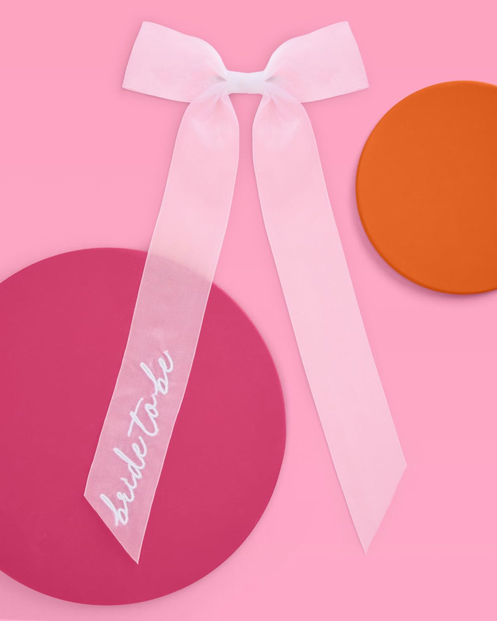 xo-fetti hair bow for bride-to-be provides comfortable hold through celebrations.
