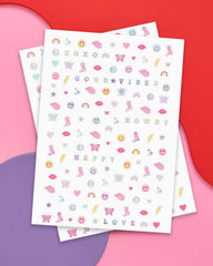xo, Fetti nail stickers rainbows butterflies and smilies for party vibes.